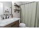 This updated bathroom features industrial shelving, modern sink, and marbled countertop at 15 Stonewood Way, Sharpsburg, GA 30277