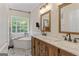 Charming primary bathroom with soaking tub, dual vanity with marble countertop, and patterned tile floor at 15 Stonewood Way, Sharpsburg, GA 30277