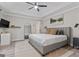 Light-filled main bedroom featuring a tray ceiling, neutral color palette, and ample space at 15 Stonewood Way, Sharpsburg, GA 30277