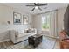 Cozy bonus room or bedroom with natural light, comfortable seating, and stylish decor at 15 Stonewood Way, Sharpsburg, GA 30277