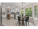 This kitchen provides stainless appliances, modern cabinets, and views of the backyard at 15 Stonewood Way, Sharpsburg, GA 30277