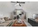 Comfortable living space featuring vaulted ceilings, a ceiling fan, a sofa and a work space at 15 Stonewood Way, Sharpsburg, GA 30277