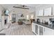 Open living room with vaulted ceiling, exposed beam, fireplace, and hardwood floors at 15 Stonewood Way, Sharpsburg, GA 30277
