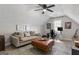 Comfortable living space featuring vaulted ceilings, a ceiling fan, a sofa and a work space at 15 Stonewood Way, Sharpsburg, GA 30277