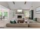Open-concept living room featuring natural light, fireplace, and seamlessly connects to the kitchen at 15 Stonewood Way, Sharpsburg, GA 30277