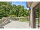 Spacious wooden deck perfect for outdoor entertaining with scenic views of lush greenery and mature trees at 3835 Hickory Branch Trl, Suwanee, GA 30024