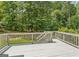 Large deck for entertaining and relaxing and overlookng a natural wooded area at 3835 Hickory Branch Trl, Suwanee, GA 30024