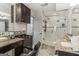 Bathroom featuring tiled walls, a glass shower, and salon styling chair at 3835 Hickory Branch Trl, Suwanee, GA 30024