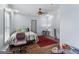Well-lit bedroom with hardwood floors, ceiling fan, and window providing natural light at 3835 Hickory Branch Trl, Suwanee, GA 30024