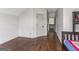 Spacious bedroom with hardwood floors, a bunk bed, and neutral walls at 3835 Hickory Branch Trl, Suwanee, GA 30024