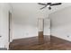 Bedroom features neutral walls, dark hardwood floors, and bright natural light at 3835 Hickory Branch Trl, Suwanee, GA 30024