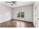 Cozy bedroom featuring hardwood floors and double windows offering lots of natural light at 3835 Hickory Branch Trl, Suwanee, GA 30024
