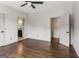Spacious bedroom with hardwood floors and a modern ceiling fan at 3835 Hickory Branch Trl, Suwanee, GA 30024