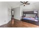 Bedroom with bunk beds, hardwood floors, and a large window at 3835 Hickory Branch Trl, Suwanee, GA 30024