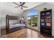 Bedroom with a bunk bed, a large window, and a bookshelf at 3835 Hickory Branch Trl, Suwanee, GA 30024