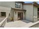 The wooden deck features lighting, and double doors to the home at 3835 Hickory Branch Trl, Suwanee, GA 30024