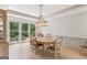 Dining room features a modern chandelier and wainscotting, and is filled with natural light at 3835 Hickory Branch Trl, Suwanee, GA 30024