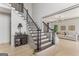 Elegant foyer with staircase leading to the upper level and view into the living room at 3835 Hickory Branch Trl, Suwanee, GA 30024