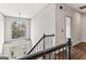 Foyer and staircase area with dark hardwood floors and an ornate round chandelier at 3835 Hickory Branch Trl, Suwanee, GA 30024