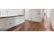 Hallway with dark hardwood floors with access to multiple rooms at 3835 Hickory Branch Trl, Suwanee, GA 30024