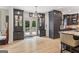 Bright kitchen with dark cabinets, stainless steel appliances, and double glass doors leading to a deck, ideal for entertaining at 3835 Hickory Branch Trl, Suwanee, GA 30024