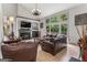 Inviting living room features a fireplace, large windows, and comfortable seating for a relaxing ambiance at 3835 Hickory Branch Trl, Suwanee, GA 30024