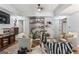 Cozy living room with comfortable seating, nice decor, and dark wood floors at 3835 Hickory Branch Trl, Suwanee, GA 30024