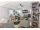 Stylish living room with comfortable seating, ceiling fan, and access to other rooms at 3835 Hickory Branch Trl, Suwanee, GA 30024
