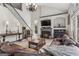 Inviting living room features a fireplace, large windows, and comfortable furnishings at 3835 Hickory Branch Trl, Suwanee, GA 30024