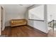 Cozy living room features hardwood floors and an inviting tan sofa for relaxation and comfort at 3835 Hickory Branch Trl, Suwanee, GA 30024