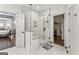 Main bathroom with a large glass-enclosed shower and access to the main bedroom and walk-in closet at 3835 Hickory Branch Trl, Suwanee, GA 30024