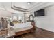 Stylish main bedroom features a bed, dresser, and a bay window at 3835 Hickory Branch Trl, Suwanee, GA 30024