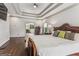 Spacious main bedroom features a large bed, dresser and connects to main bathroom at 3835 Hickory Branch Trl, Suwanee, GA 30024