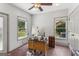 Bright office with hardwood floors, natural light and simple desk at 3835 Hickory Branch Trl, Suwanee, GA 30024