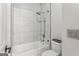 Elegant bathroom shower with glass enclosure, rainfall showerhead, and classic white tiling at 3835 Hickory Branch Trl, Suwanee, GA 30024