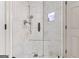 Modern shower with glass enclosure, built-in shower niche, and sleek fixtures at 3835 Hickory Branch Trl, Suwanee, GA 30024