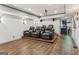 Basement theater room features tiered seating, projector, and hardwood floors at 3835 Hickory Branch Trl, Suwanee, GA 30024
