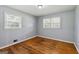 Bedroom features hardwood floors, natural light, and ceiling fan at 4653 Ridgewood Dr, Forest Park, GA 30297