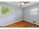 Bedroom boasting hardwood floors, natural light, and a ceiling fan at 4653 Ridgewood Dr, Forest Park, GA 30297
