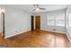 Empty living room showcases hardwood floors, a ceiling fan, and neutral paint at 4653 Ridgewood Dr, Forest Park, GA 30297