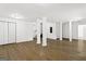Large open basement area with wood-look flooring, support columns, and white walls at 2835 Laguna Dr, Decatur, GA 30032