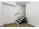Basement stairs with wood treads and a white painted riser and adjacent wall at 2835 Laguna Dr, Decatur, GA 30032