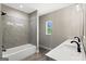 Bathroom featuring tub and shower combo with single sink vanity at 2835 Laguna Dr, Decatur, GA 30032