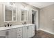 Bathroom featuring dual sinks with vanity and mirrors at 2835 Laguna Dr, Decatur, GA 30032