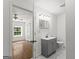 Stylish bathroom view from bedroom, highlighting modern vanity, mirror, and tile flooring at 2835 Laguna Dr, Decatur, GA 30032