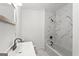 Contemporary bathroom with modern fixtures, including a shower-tub combo and marble tile at 2835 Laguna Dr, Decatur, GA 30032