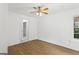 Bright bedroom featuring a ceiling fan, natural light, and wood-look flooring at 2835 Laguna Dr, Decatur, GA 30032