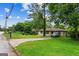 Single-story home with lush green lawn and a convenient driveway at 2835 Laguna Dr, Decatur, GA 30032