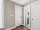 Hallway with doors leading to different rooms, featuring hardwood floors at 2835 Laguna Dr, Decatur, GA 30032