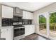 Updated kitchen with stainless steel appliances and access to a deck at 2835 Laguna Dr, Decatur, GA 30032
